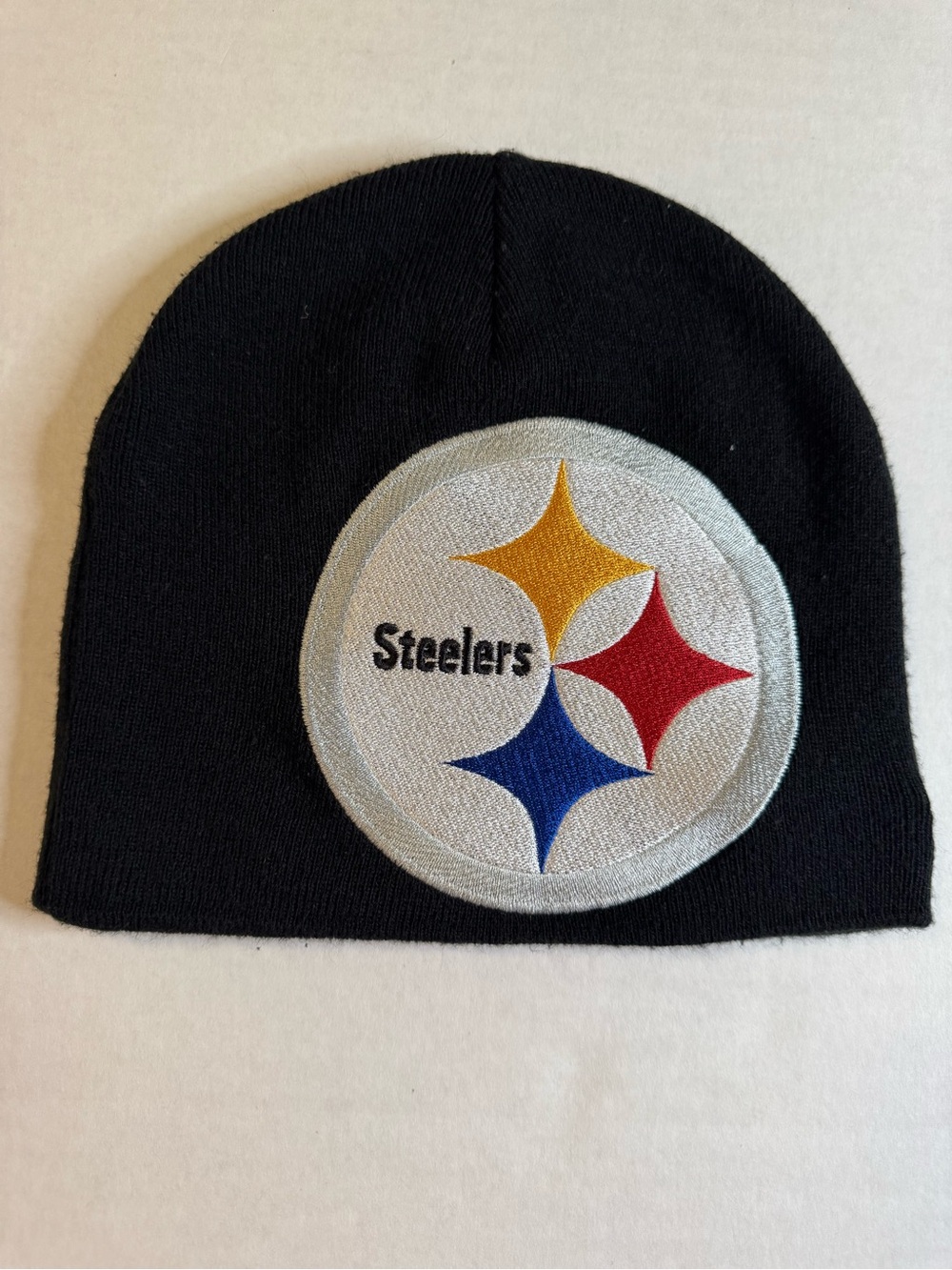 New Era Black Steelers Beanie with Yellow Red Blue Logo